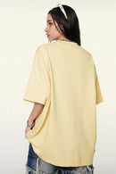 Ultra-Heavyweight Drop-Shoulder T-Shirt in Cream Apricot - rear three-quarter modeled view