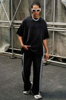 Heavyweight Washed Drop-Shoulder Cotton T-Shirt in Black - full-length front modeled view