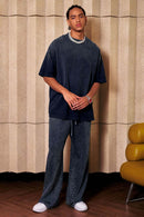 Heavyweight Washed Drop-Shoulder Cotton T-Shirt in Navy Blue - full-length front modeled view