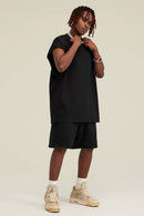 Heavyweight Relaxed Wide-Shoulder Cotton Sleeveless Top in Black - full-length front modeled view