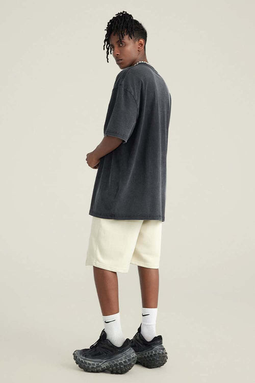 Washed Gradient Cotton Relaxed Drop-Shoulder T-Shirt in Black - full-length back modeled view
