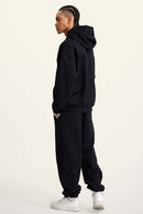 Heavyweight Puff-Print Letter Graphic Pullover Hoodie in Active Black - full-length back modeled view