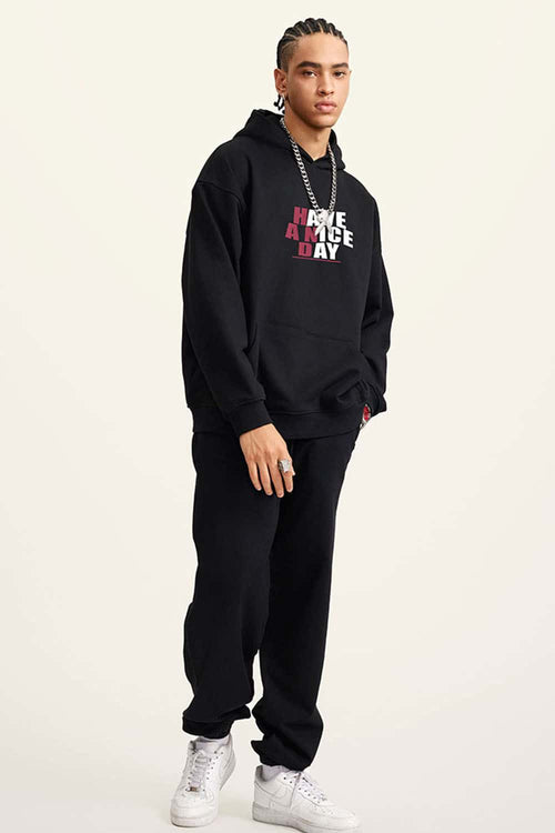 Heavyweight Puff-Print Letter Graphic Pullover Hoodie in Active Black - full-length front modeled view