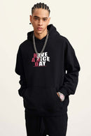 Heavyweight Puff-Print Letter Graphic Pullover Hoodie in Active Black - front modeled close-up
