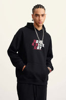 Heavyweight Puff-Print Letter Graphic Pullover Hoodie in Active Black - front modeled close-up