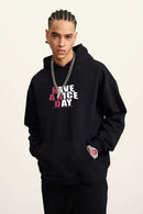 Heavyweight Puff-Print Letter Graphic Pullover Hoodie in Active Black - front modeled close-up