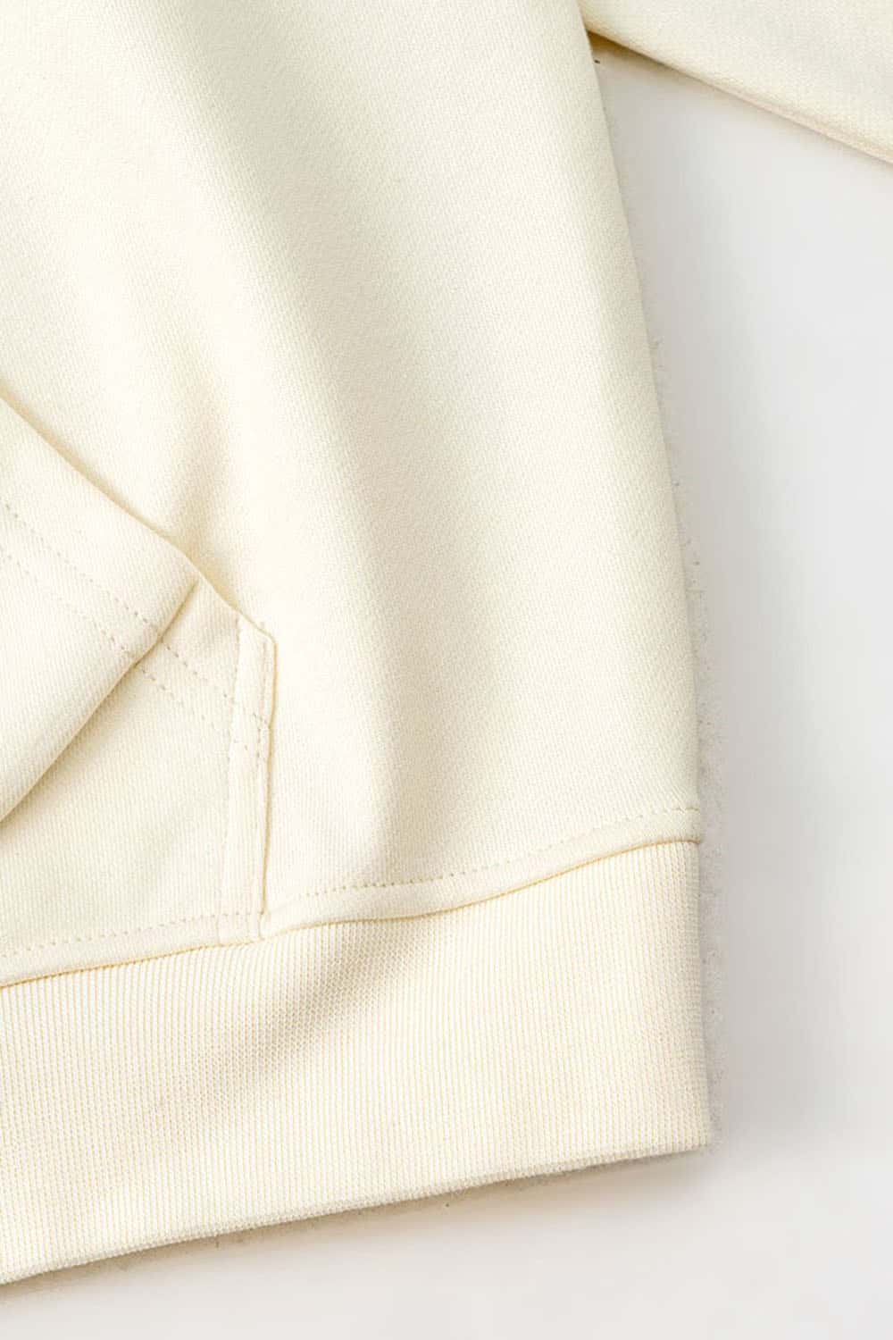 Heavyweight Puff-Print Letter Graphic Pullover Hoodie in Milk Tea White - hem detail