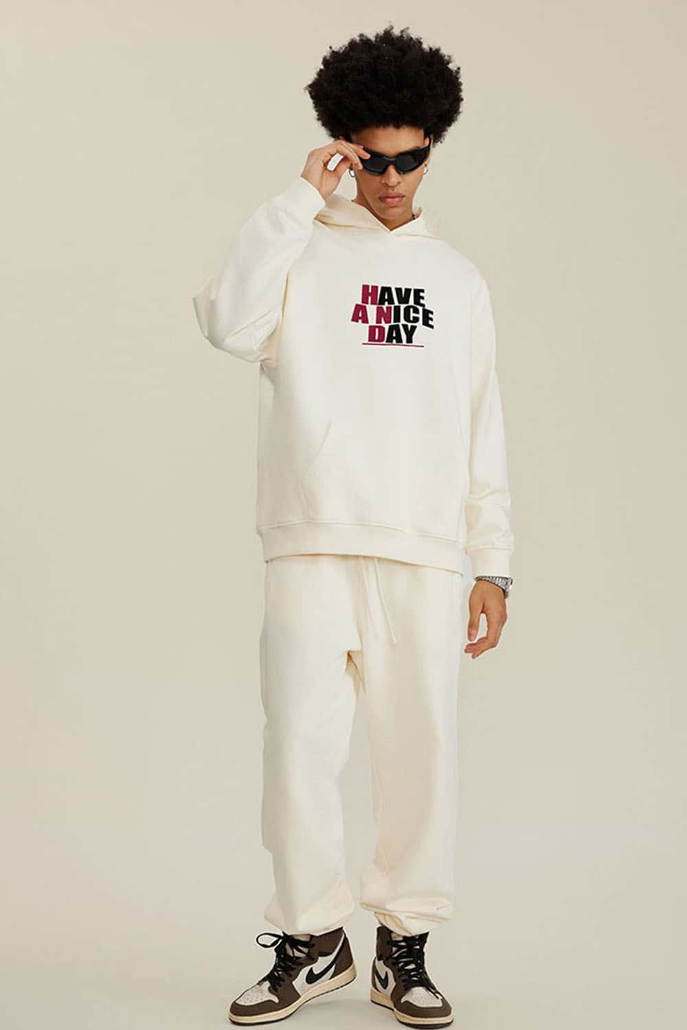 Heavyweight Puff-Print Letter Graphic Pullover Hoodie in Milk Tea White - full-length front modeled view