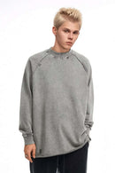 Breathable Distressed Raw-Edge Cotton Sweatshirt in Medium Gray - front modeled view