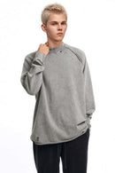 Breathable Distressed Raw-Edge Cotton Sweatshirt in Medium Gray - front modeled view