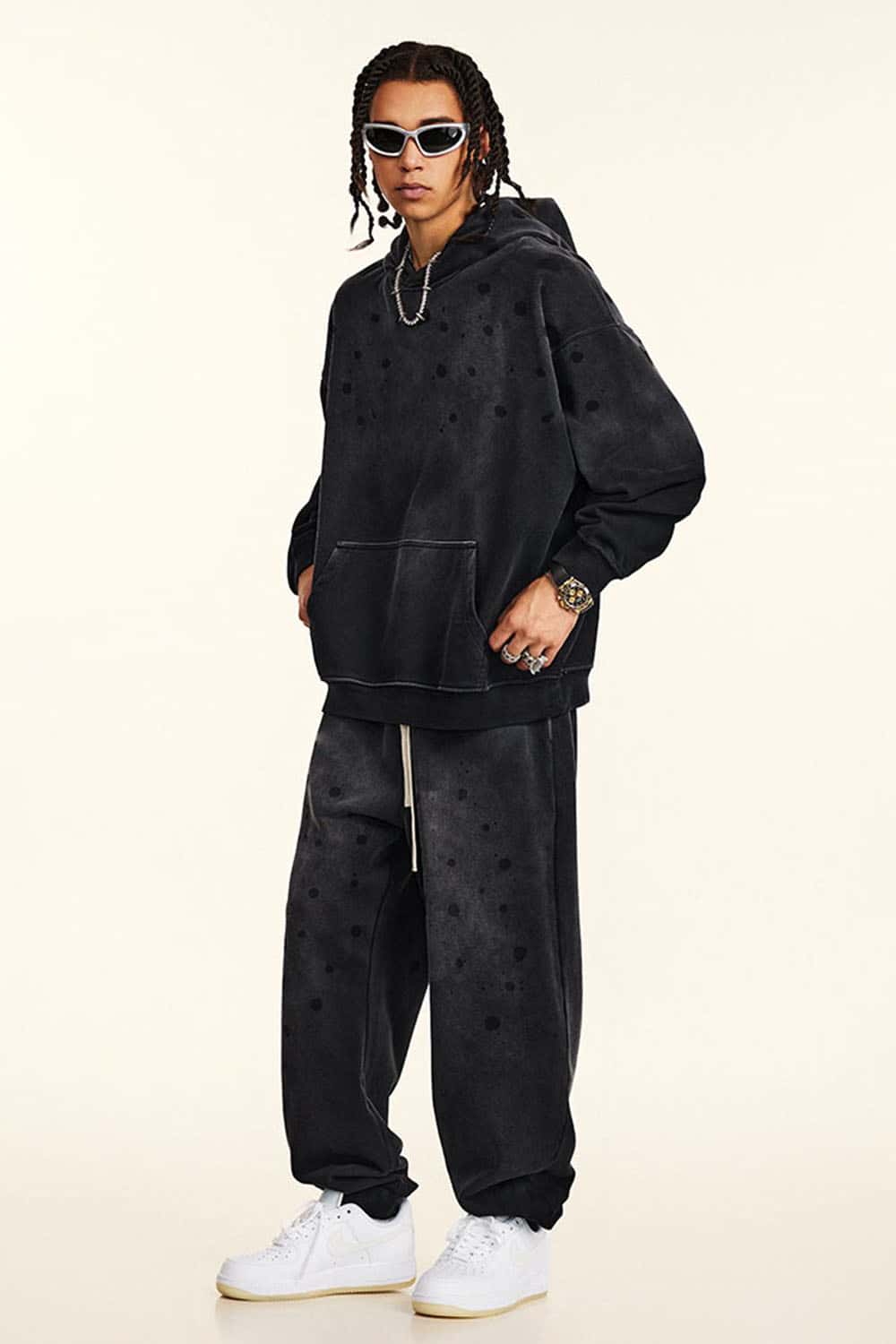 Washed Paint-Splatter Pullover Hoodie in Black - full-length front modeled view