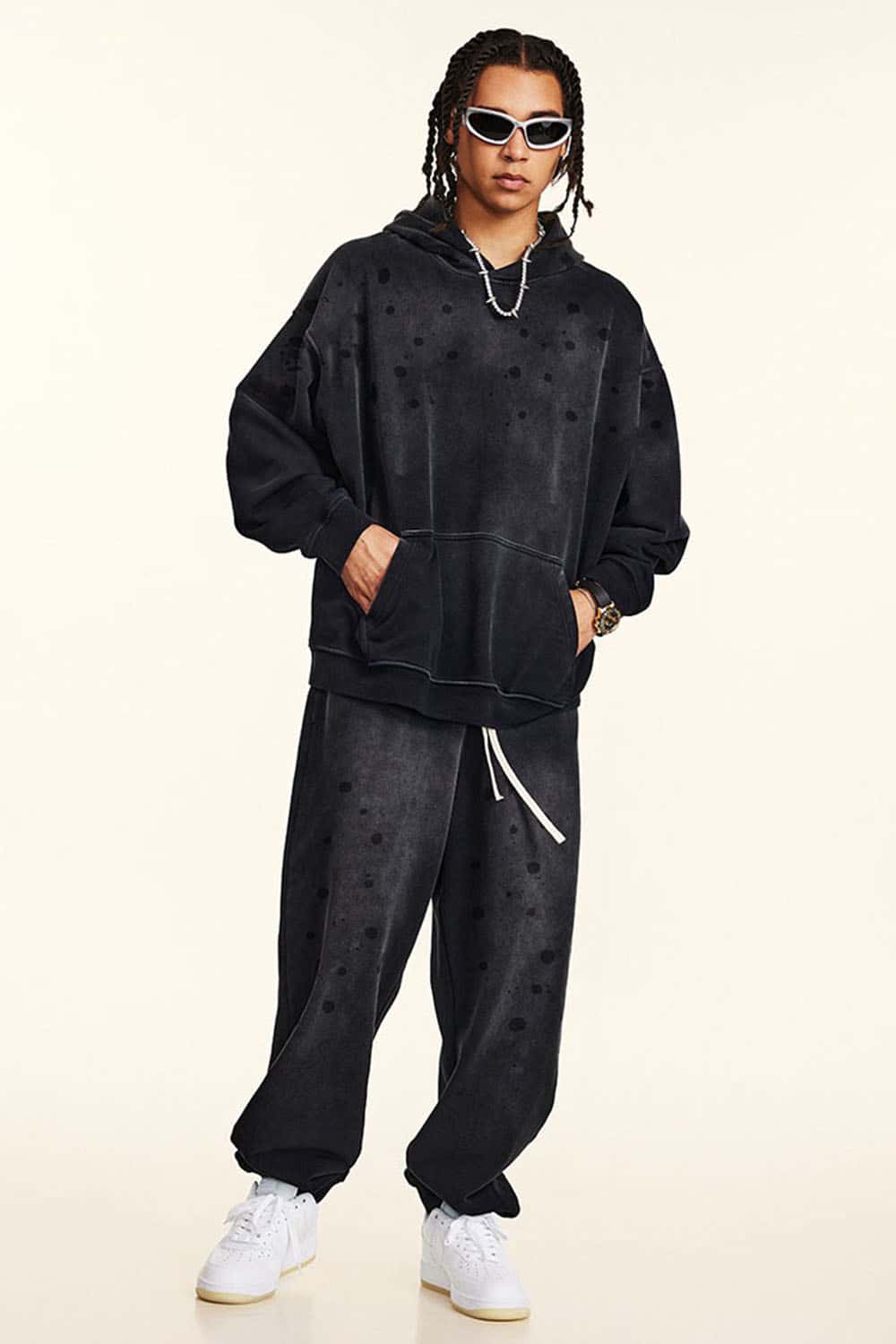 Washed Paint-Splatter Pullover Hoodie in Black - full-length front modeled view