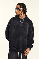 Washed Paint-Splatter Pullover Hoodie in Black - front modeled view