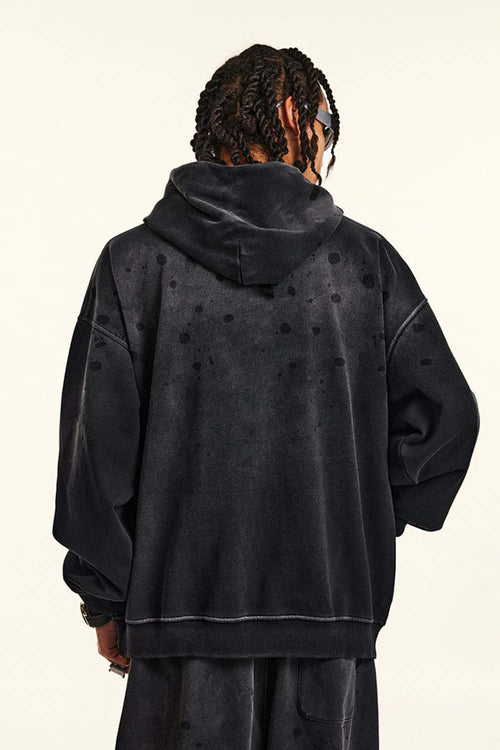 Washed Paint-Splatter Pullover Hoodie in Black - back modeled view