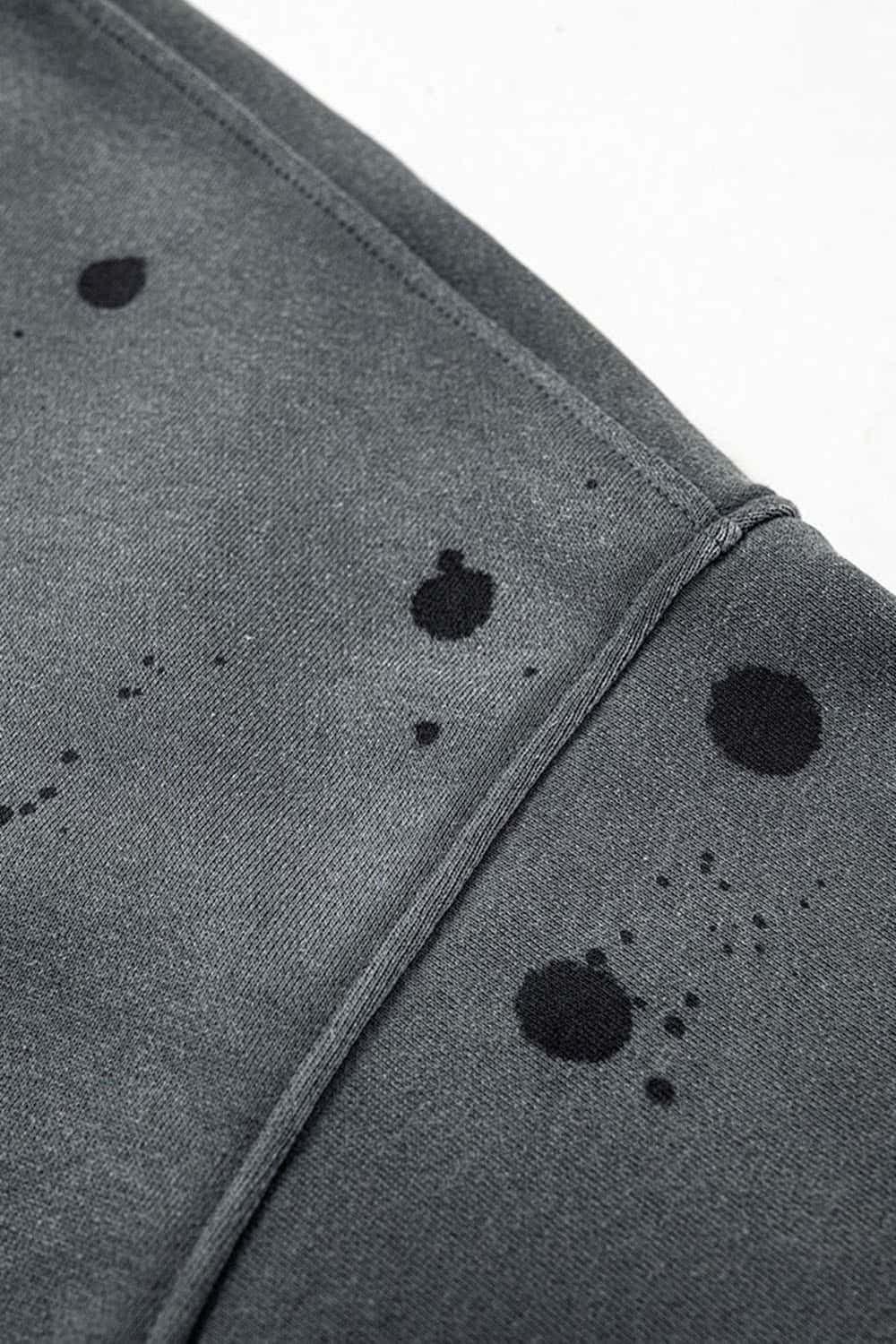 Washed Paint-Splatter Pullover Hoodie in Dark Gray - modeled view