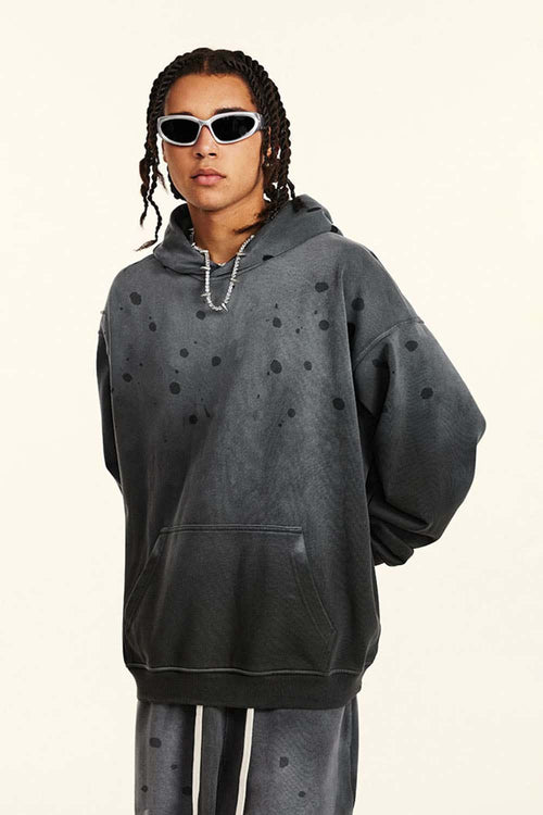 Washed Paint-Splatter Pullover Hoodie in Dark Gray - front modeled view