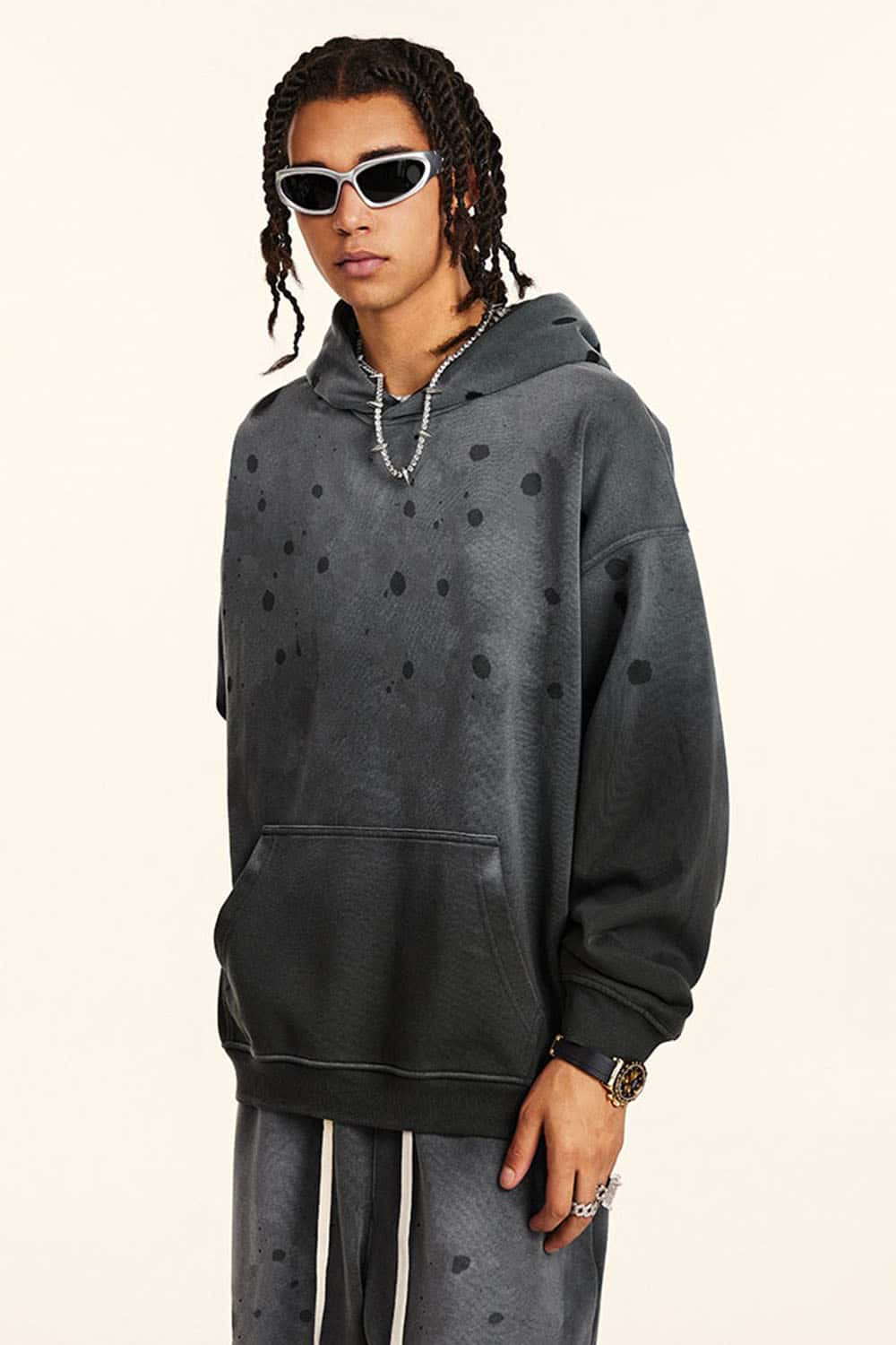 Washed Paint-Splatter Pullover Hoodie in Dark Gray - three-quarter front modeled view