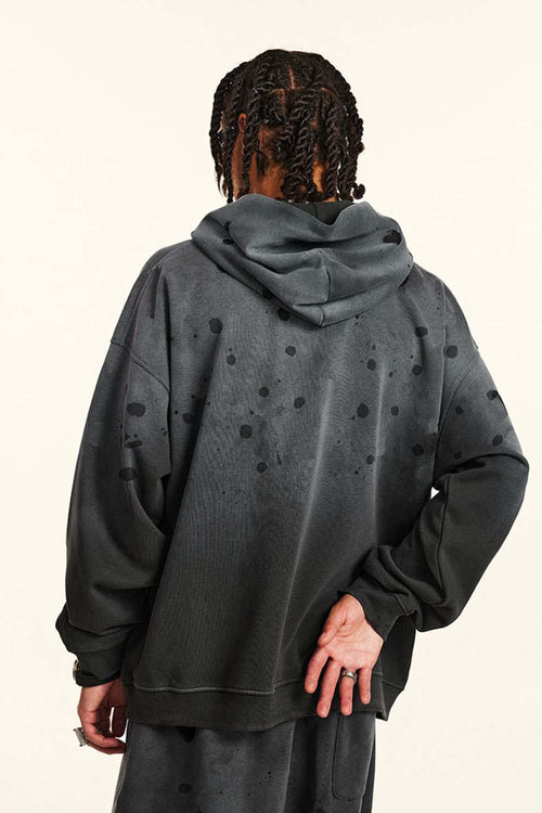 Washed Paint-Splatter Pullover Hoodie in Dark Gray - back modeled view
