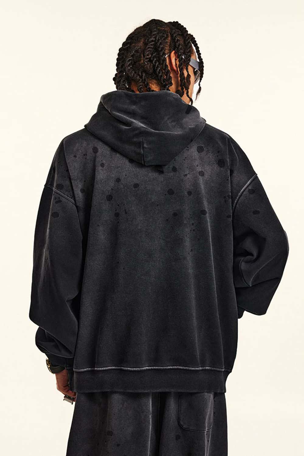 Distressed Gradient-Wash Splatter-Graphic Pullover Hoodie in Black - back modeled view