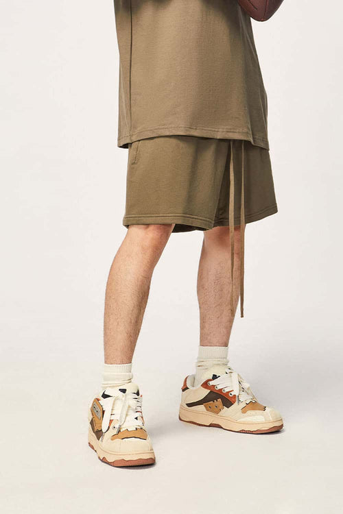 Heavyweight Cotton Relaxed-Fit Drawstring Shorts in Brown - three-quarter front modeled view