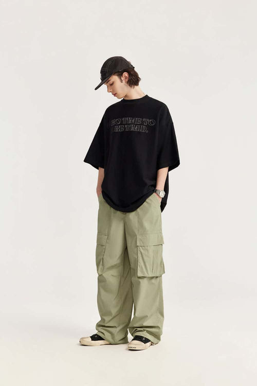 Waterproof Multi-Pocket Wide-Leg Cargo Pants in Grayish Green - full-length front modeled view