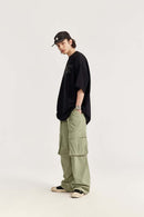Waterproof Multi-Pocket Wide-Leg Cargo Pants in Grayish Green - full-length modeled view