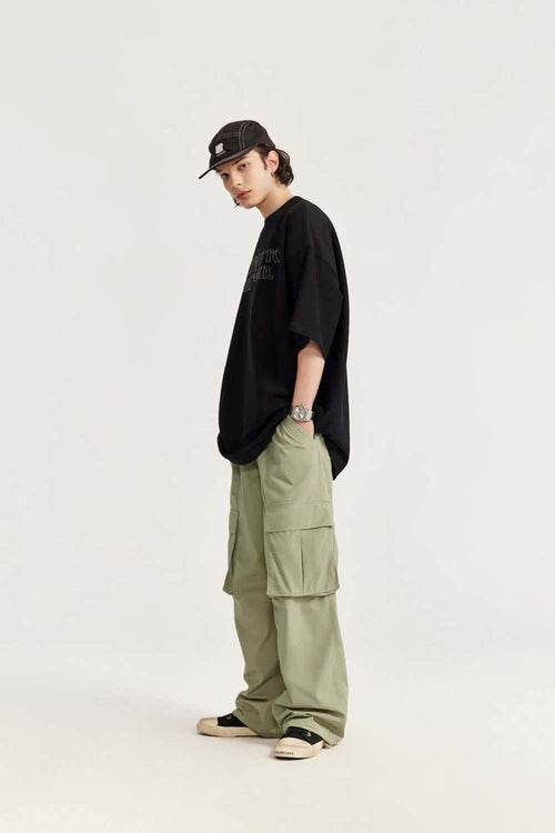 Waterproof Multi-Pocket Wide-Leg Cargo Pants in Grayish Green - full-length modeled view