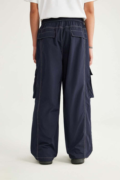 Waterproof Multi-Pocket Wide-Leg Cargo Pants in Navy Blue - full-length back modeled view