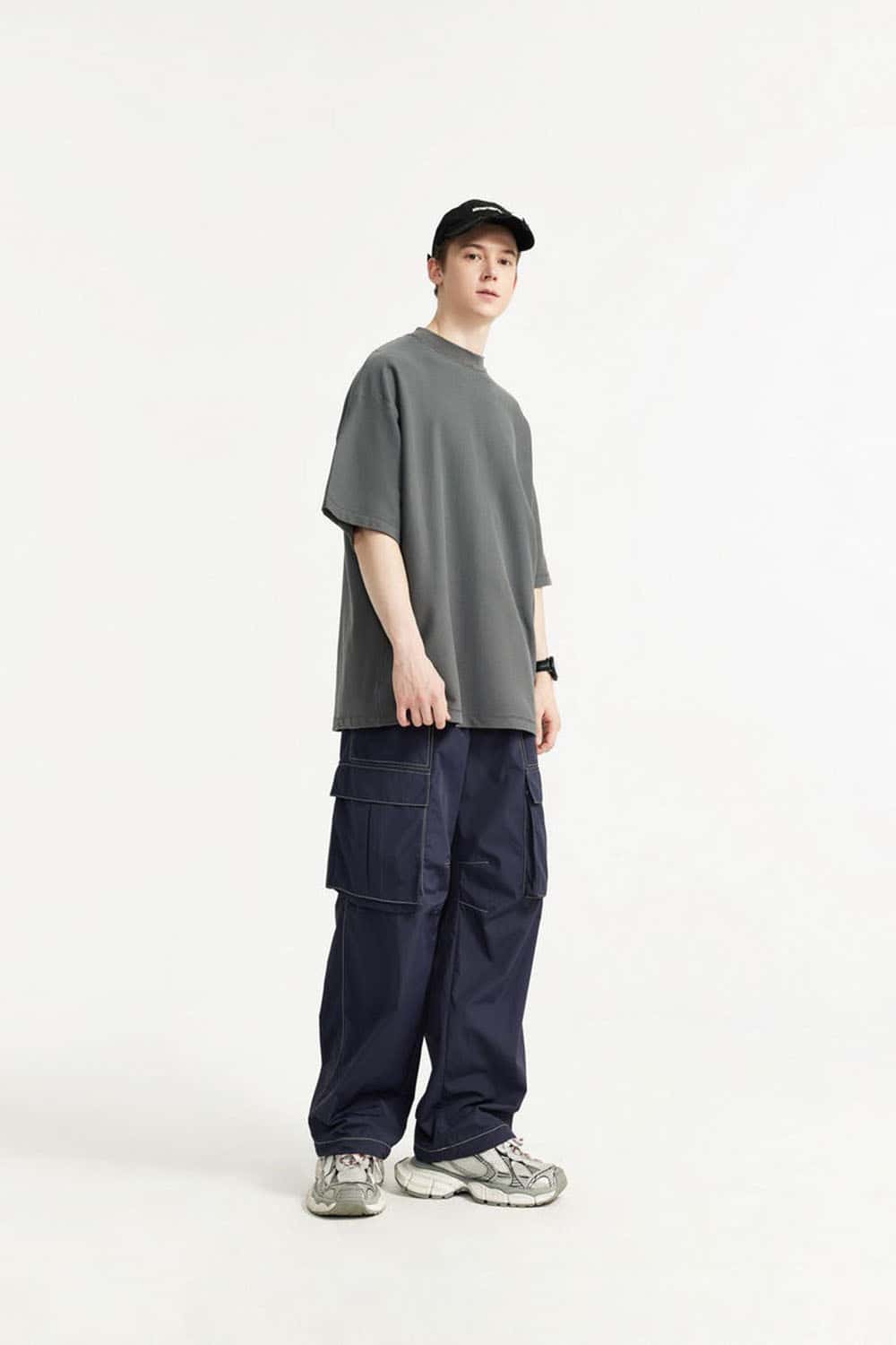 Waterproof Multi-Pocket Wide-Leg Cargo Pants in Navy Blue - full-length side modeled view