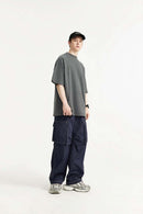 Waterproof Multi-Pocket Wide-Leg Cargo Pants in Navy Blue - full-length side modeled view