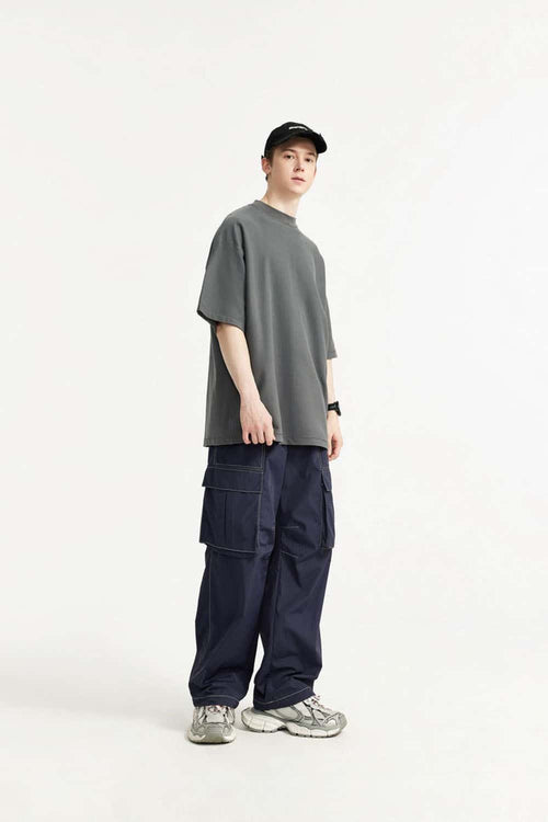 Waterproof Multi-Pocket Wide-Leg Cargo Pants in Navy Blue - full-length side modeled view