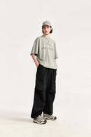 Convertible Multi-Pocket Cargo Pants in Black - three-quarter front modeled view