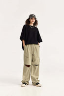 Convertible Multi-Pocket Cargo Pants in Khaki - full-length front modeled view