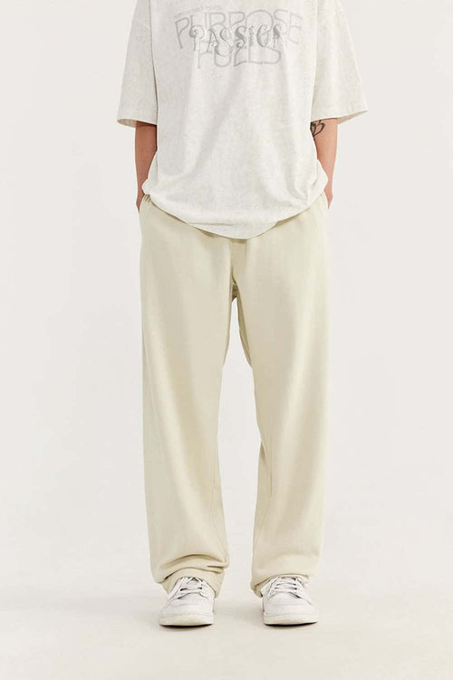 Heavyweight Cotton-Blend Relaxed Straight-Leg Sweatpants in Rice Apricot - front modeled view