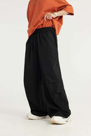 Layered-Pocket Drawstring Wide-Leg Pants in Black - waistband detail