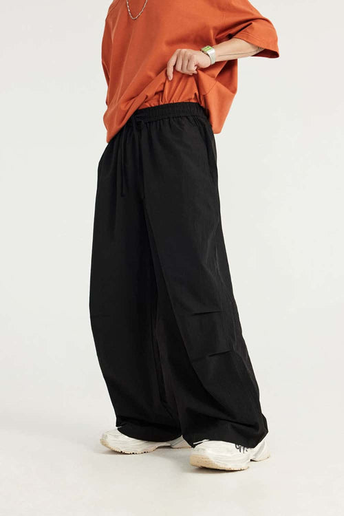 Layered-Pocket Drawstring Wide-Leg Pants in Black - waistband detail