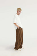 Layered-Pocket Drawstring Wide-Leg Pants in Brown - full-length side modeled view