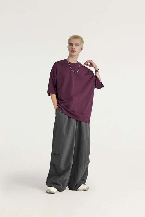 Layered-Pocket Drawstring Wide-Leg Pants in Dark Gray - full-length front modeled view