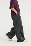 Layered-Pocket Drawstring Wide-Leg Pants in Dark Gray - full-length side modeled view