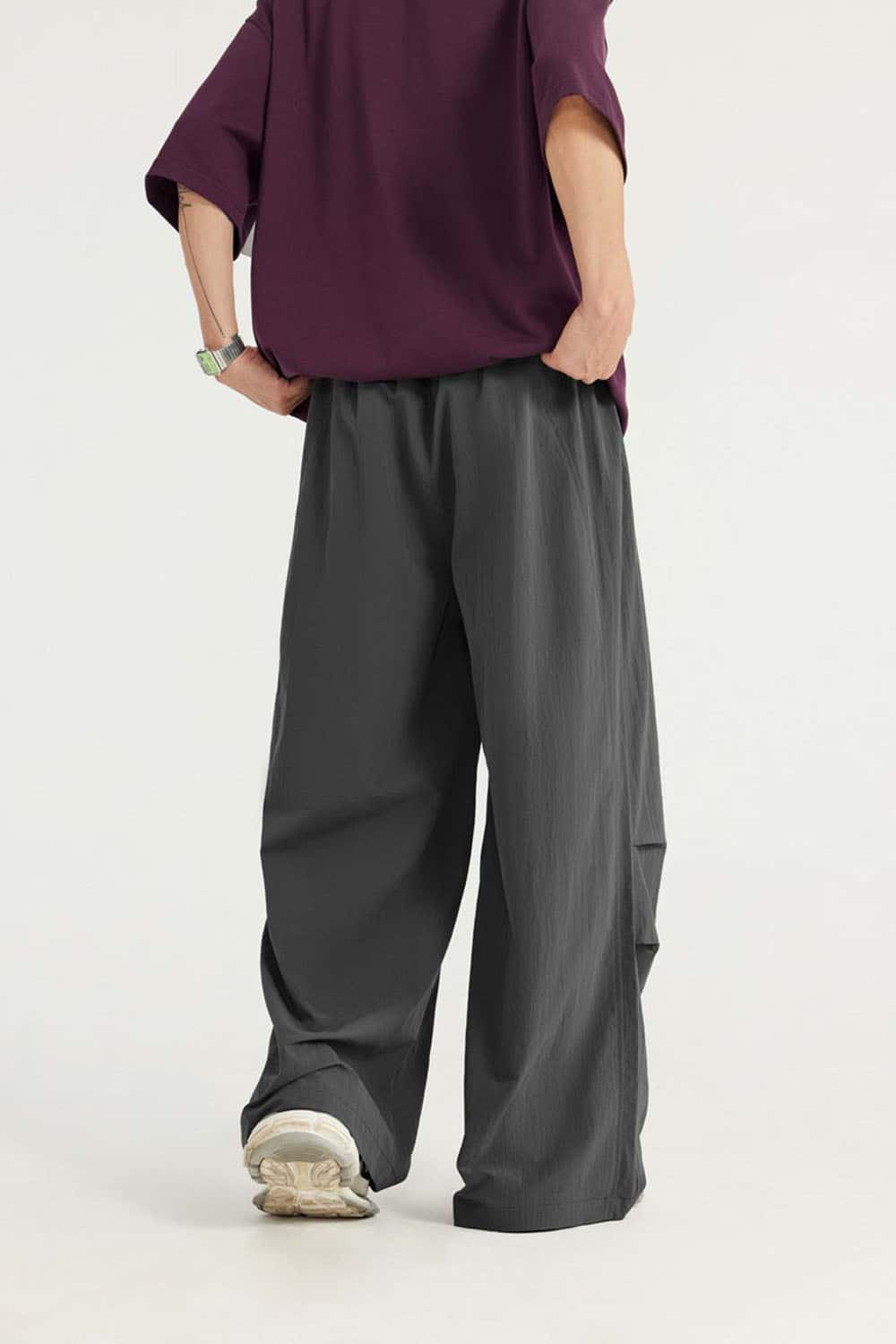 Layered-Pocket Drawstring Wide-Leg Pants in Dark Gray - back modeled view