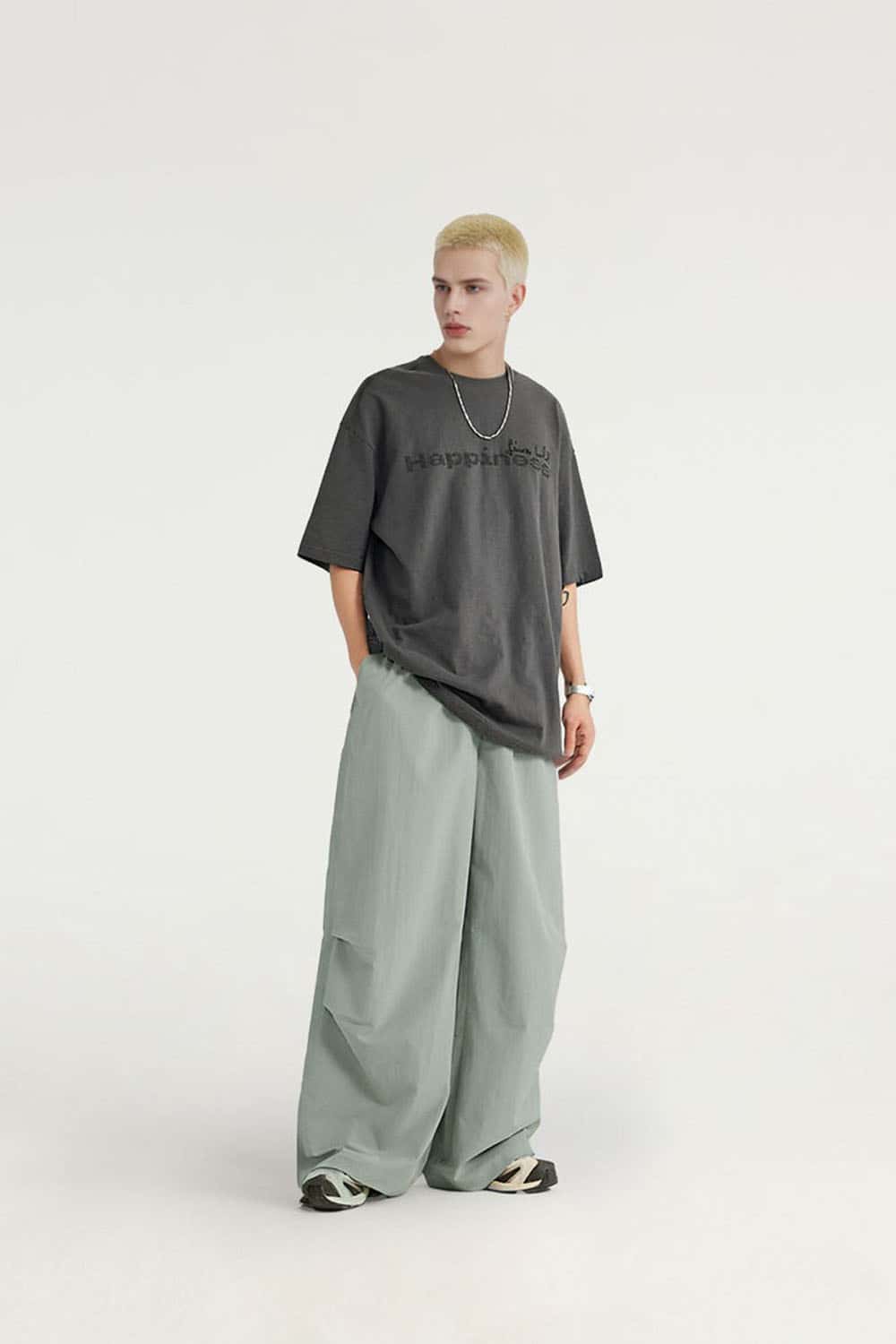 Layered-Pocket Drawstring Wide-Leg Pants in Grayish Green - full-length front modeled view