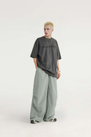 Layered-Pocket Drawstring Wide-Leg Pants in Grayish Green - full-length front modeled view