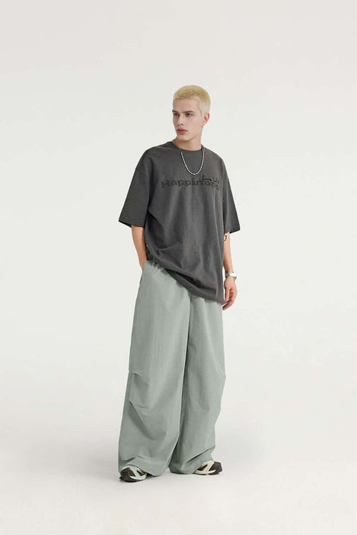 Layered-Pocket Drawstring Wide-Leg Pants in Grayish Green - full-length front modeled view