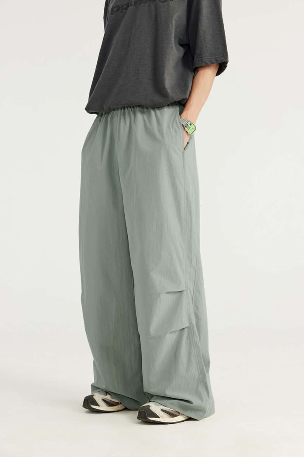 Layered-Pocket Drawstring Wide-Leg Pants in Grayish Green - front modeled view