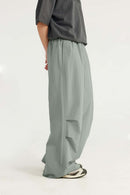Layered-Pocket Drawstring Wide-Leg Pants in Grayish Green - back modeled view