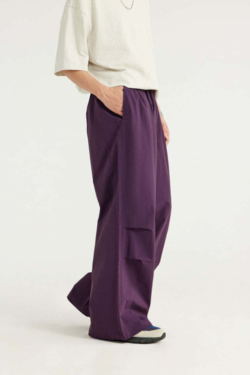 Layered-Pocket Drawstring Wide-Leg Pants in Purple - side modeled view