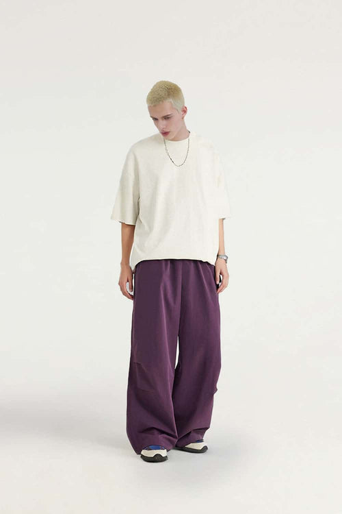 Layered-Pocket Drawstring Wide-Leg Pants in Purple - full-length front modeled view