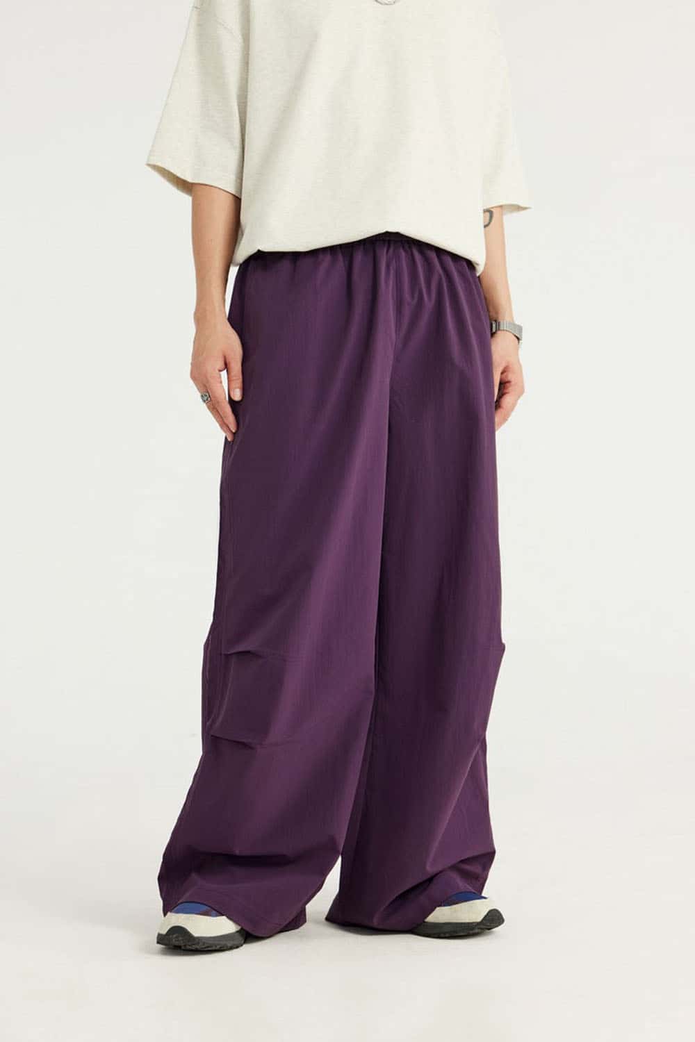 Layered-Pocket Drawstring Wide-Leg Pants in Purple - front modeled view