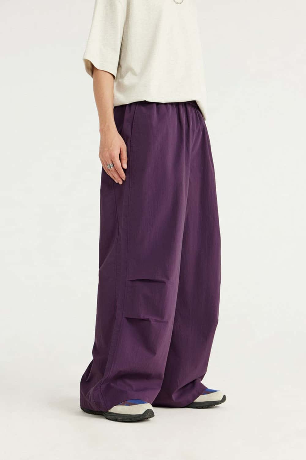 Layered-Pocket Drawstring Wide-Leg Pants in Purple - front modeled view