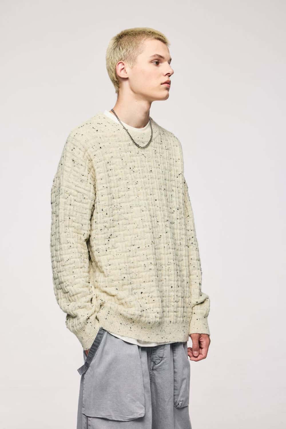 Abrasion-Resistant Flecked Geometric-Knit Crewneck Sweater in Apricot - three-quarter front modeled view